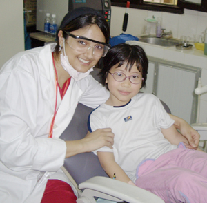 Dr. Khan working with a child